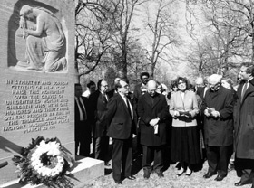 Members of the ILGWU gather around the Longman memorial for unidenitifed victims of the fire