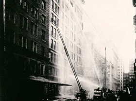Ladders and fire equipment in front of the Asch Builing on Washington Place