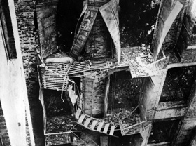 Twisted remains of the fire escape that collapsed, sending people to their deaths eight stories below